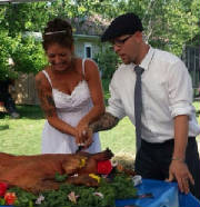 Newly Weds First Cut by Flying Pig Roast Copywright